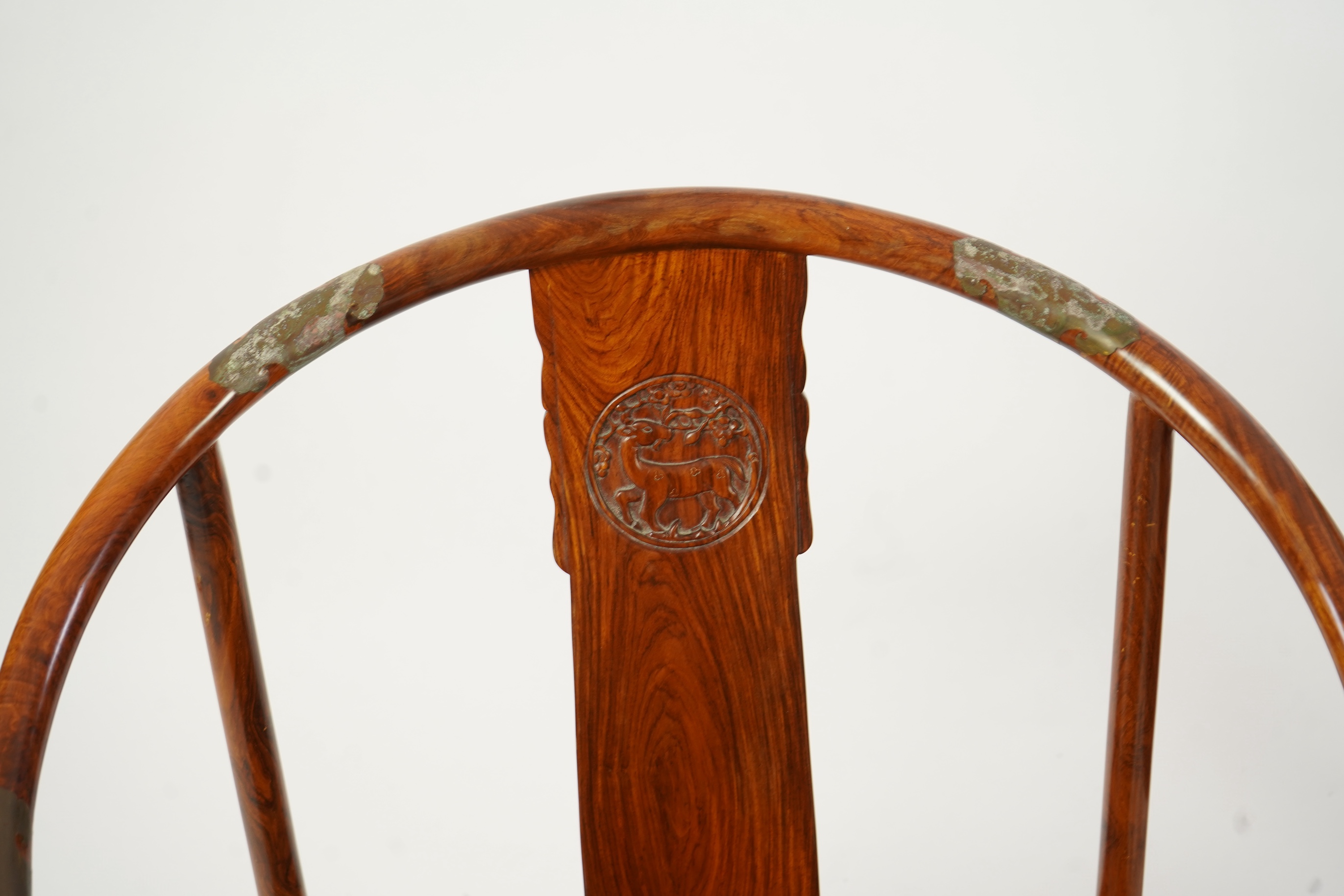 A pair of Chinese huanghuali and brass mounted horseshoe-back armchairs, quanyi, 19th century